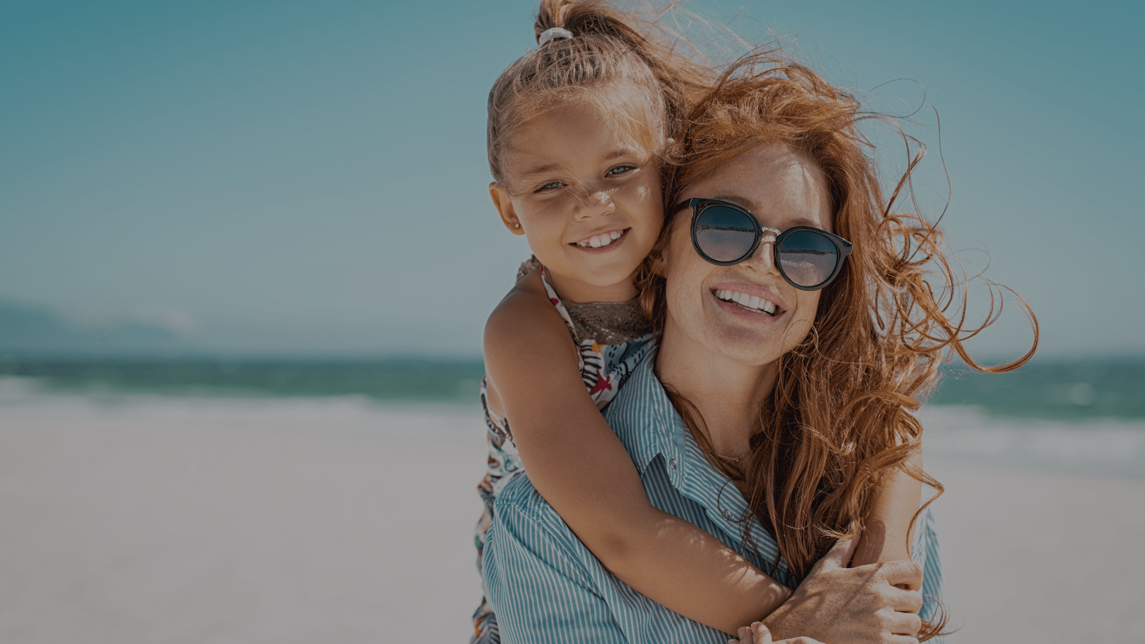 a mom with a child happy to have had a mommy makeover